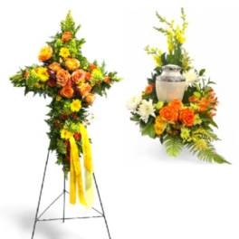 Standing floral cross and urn arrangement with orange and yellow flowers