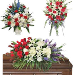 Floral casket spray with red, white, and purple flowers