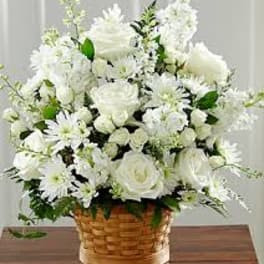 White floral arrangement in a wicker basket