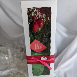 Boxed bouquet of red roses with white baby's breath