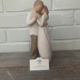 Wooden figurine of a couple embracing