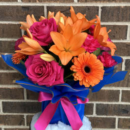 Bouquet of pink roses and orange lilies with a gerbera daisy
