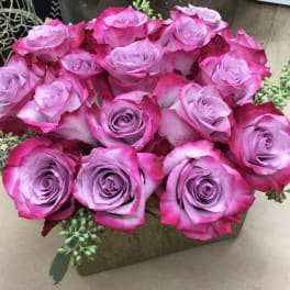 Bouquet of pink and lavender roses with succulent accents
