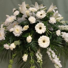 White floral spray with lilies, daisies, and carnations