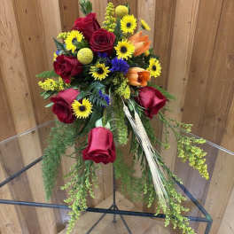 Bouquet of red roses, yellow daisies, and orange lilies