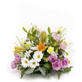 Mixed bouquet with pink roses, white daisies, lilies, and orange blooms