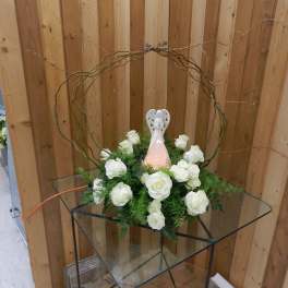 White rose arrangement with a decorative angel topper