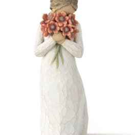 Figurine of a girl holding a bouquet of orange flowers