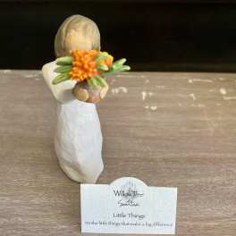 Small Willow Tree figurine holding an orange flower bouquet