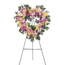 Heart-shaped floral wreath on a standing easel