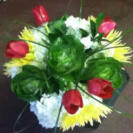Bouquet of red tulips, white hydrangeas, and yellow spider mums