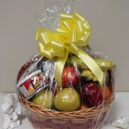 Fruit basket wrapped in cellophane with a yellow bow
