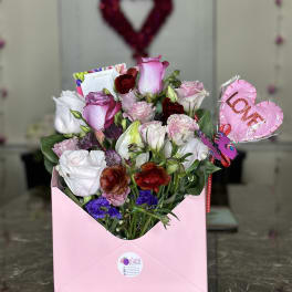 Pink and white rose bouquet in a pink gift box with a heart balloon
