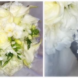 White bridal bouquet with roses, calla lilies, and a satin ribbon handle