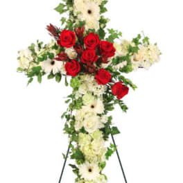 Cross-shaped floral standing spray with red roses and white blooms