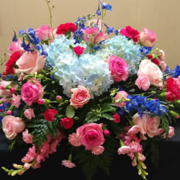 Mixed bouquet with pink roses, blue hydrangeas, and blue flowers