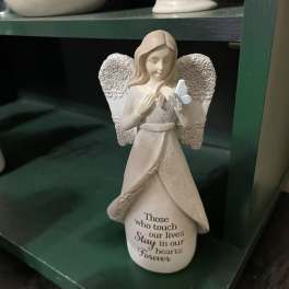 Angel figurine holding a butterfly with a memorial quote on the base