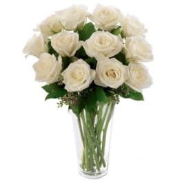 Bouquet of white roses in a clear glass vase