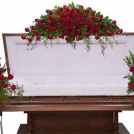Red rose funeral casket spray with matching side arrangements
