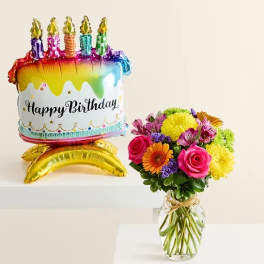 Birthday balloon with a colorful flower bouquet in a glass vase