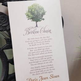Memorial card with a tree graphic and poem on a white card