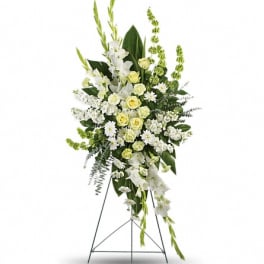 Tall white and pale yellow floral standing spray on an easel
