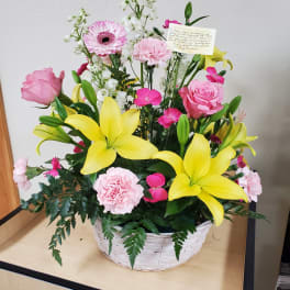 White Wicker Basket with Assortment of Flowers