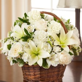 White flowers arranged in a wicker basket