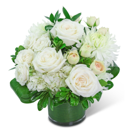White roses and chrysanthemums arranged in a green vase