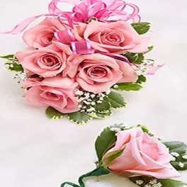 Pink rose bouquet with a matching rose boutonniere