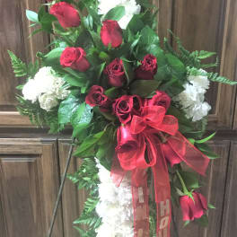 cross with red roses