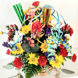 Colorful flower basket with ribbon curls and metallic party horns