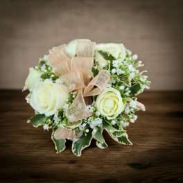 Small bouquet of white roses with a sheer ribbon