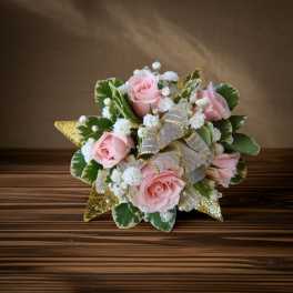 Pink rose bouquet with white filler flowers and gold ribbon accents