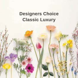 Assorted flowers arranged around the words "Designers Choice Classic Luxury"