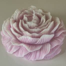 Pink rose-shaped candle with layered petals
