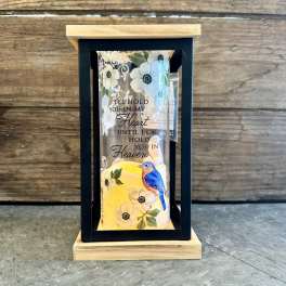 Decorative memorial lantern with flowers, a bird, and a remembrance message