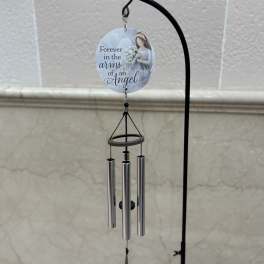 Memorial wind chime with an angel plaque and silver tubes