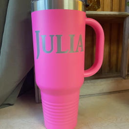 Pink insulated tumbler with the name Julia on the front