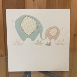 A card with two cartoon elephants touching trunks.
