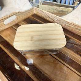 Wooden tray with a clear-lidded rectangular container on top