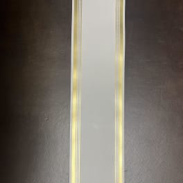 White ribbon with gold and silver decorative borders