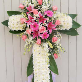 Cross-shaped floral spray with pink and white flowers