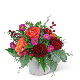 Bouquet of orange and red roses with purple daisies in a white vase