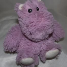 Purple plush hippo toy with white feet and ears