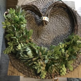 Succulent wreath on a woven straw base