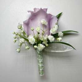 Lavender rose boutonniere with white baby's breath and ribbon wrap