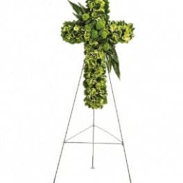 Green floral cross on a metal stand