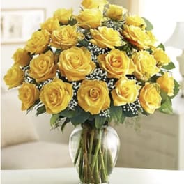 Bouquet of yellow roses in a clear glass vase