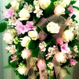 Tall standing floral spray with white roses and pink lilies